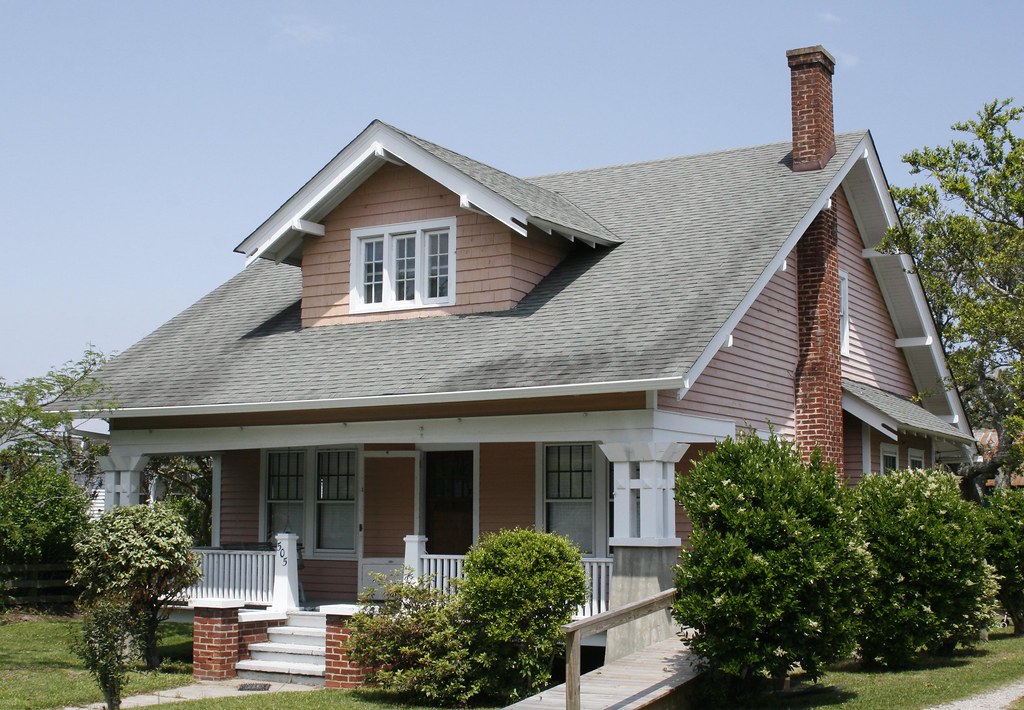 Suburban house with a pitched shingle roof